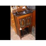 An Edwardian inlaid cabinet