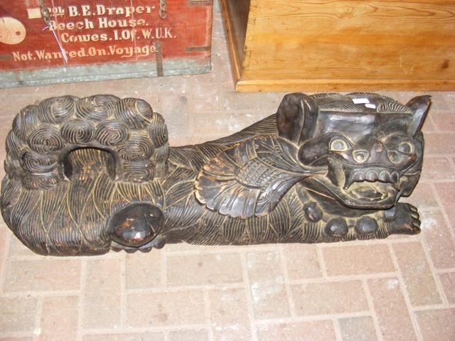 A large carved wooden oriental Dog of Foe - 100cm