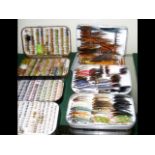 A selection of fishing flies in Wheatley case and