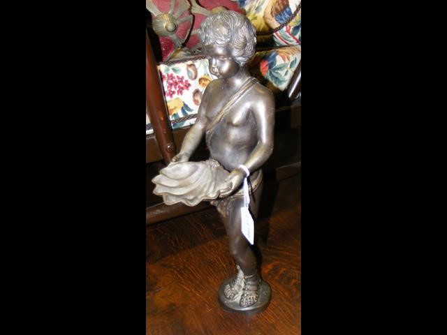 An old bronze figure of cherub holding shell - 40c