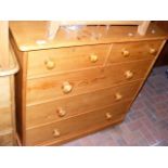 An antique pine chest of drawers