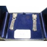 A pair of silver and marcasite drop earrings, set