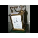 A small brass cased carriage clock by The London C