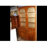 A late Victorian bookcase with glazed upper sectio