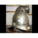 An old Fireman's helmet with leather chin strap