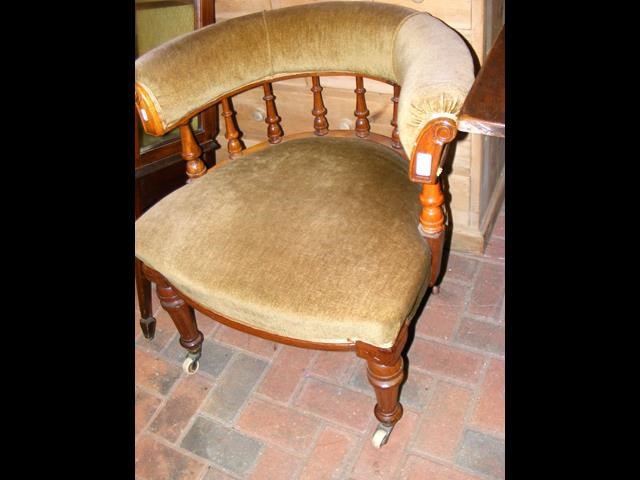 A 19th century tub office chair on turned supports