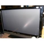 A Pioneer flat screen television with remote