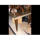 A large mahogany dining table on square tapering s