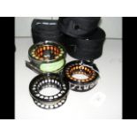 One fly fishing reel and two fly fishing spools