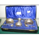 A cased silver condiment set