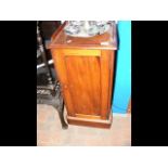 A Victorian mahogany bedside table with enclosed s