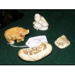 A collection of four Japanese netsuke, including a