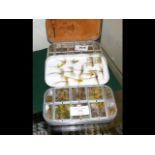 A selection of fishing flies in Wheatley case and