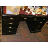 An antique pedestal desk