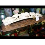 A 43cm carved ivory tusk group of bears and seals