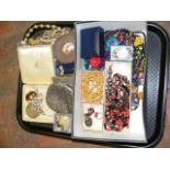 A tray of costume jewellery and collectable coins