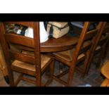 An antique rustic French pine extending dining tab