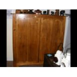 A 150cm wide pine cupboard
