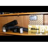 A selection of Nikon camera accessories, including