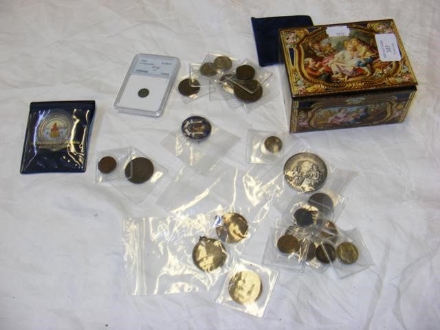 A tin of 19th/20th century coins, with an enamelle