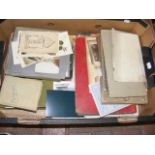 A box containing various ephemera, including photo