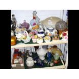 Two shelves of collectable ceramic and glassware i