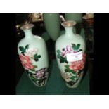 A pair of 19cm high cloisonne vases with floral decor