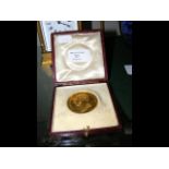 An 18ct gold (tested) presentation medallion - Rub