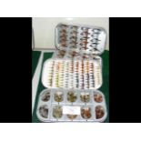 A selection of fishing flies in Okuma case, togeth