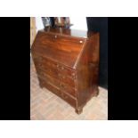 A Georgian mahogany fall front bureau with drawers