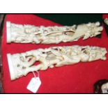 Two 34cm ornately carved ivory tusk groups