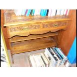 A carved oak two drawer side table