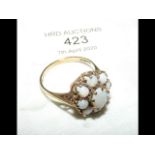 A gold and opal cluster ring