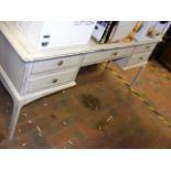 A 'shabby chic' dressing table on spindle legs wit