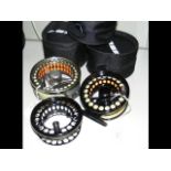 Two fly fishing reels and one fly fishing spool