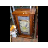 An inlaid glazed cabinet