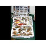 A selection of fishing flies in Wheatley case and