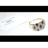A sapphire and diamond ring in 14ct gold setting