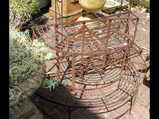 An old Victorian wrought iron plant stand, togethe