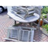 A garden table, together with six folding chairs