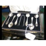 A cased set of six silver teaspoons and sugar tong