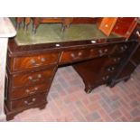 A reproduction pedestal desk