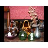 An assortment of glass paperweights, ornaments and