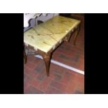 A vintage gilt coffee table with faux onyx top - l