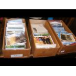 Three boxes of postcards