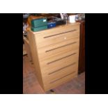 An oak effect chest of five long drawers - height