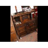 A Jacobean style carved oak court cupboard - 125cm