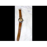 A vintage Oyster Junior Sport wrist watch with man