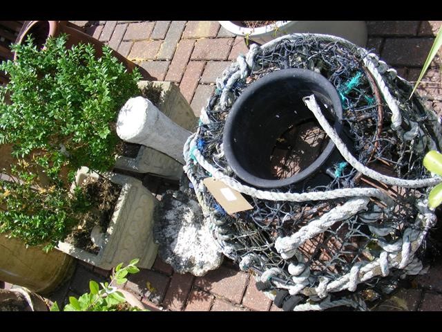 An old lobster pot, together with a pair of square