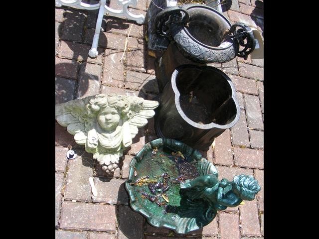 A cast metal garden urn on stand, together with tw